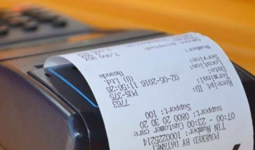 A point of sale terminal printing a fiscal receipt showing a TIN number